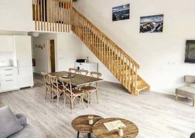 Living room and chairs to bedroom in Blabjorg family room