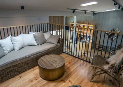 Sofa and chairs on an inside balcony in Blabjorg guesthousr