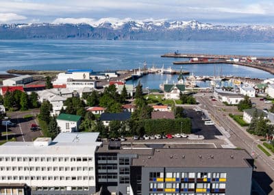Overlooking the Fosshotel Húsavík, the village, port, the bay and snwo montains